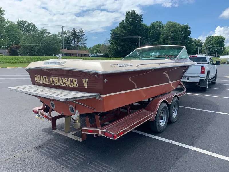 Slide: The Image of 2005 Coronado Custom boat Small Change V on a trailer in a parking lot. - 5