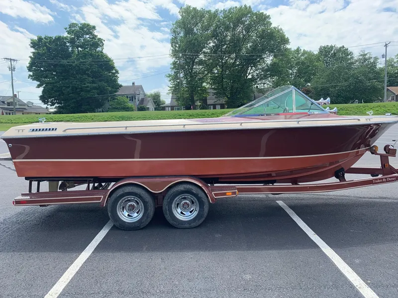 Slide: The Image of 2005 Coronado Custom boat on a trailer in a parking lot. - 6