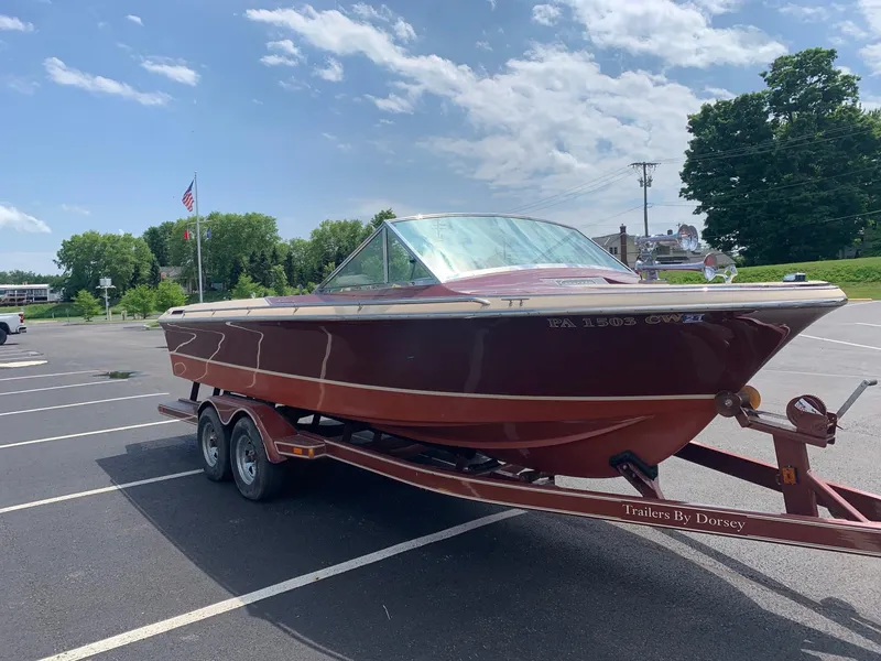 Slide: The Image of 2005 Coronado Custom boat on a trailer in a parking lot. - 7