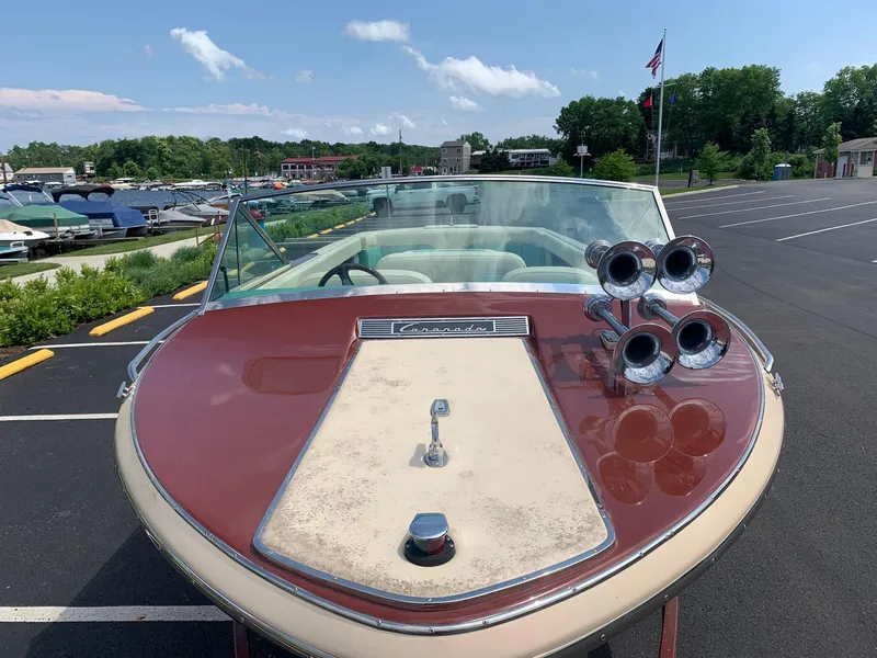 Slide: The Image of 2005 Coronado Custom boat parked near marina on a sunny day. - 8