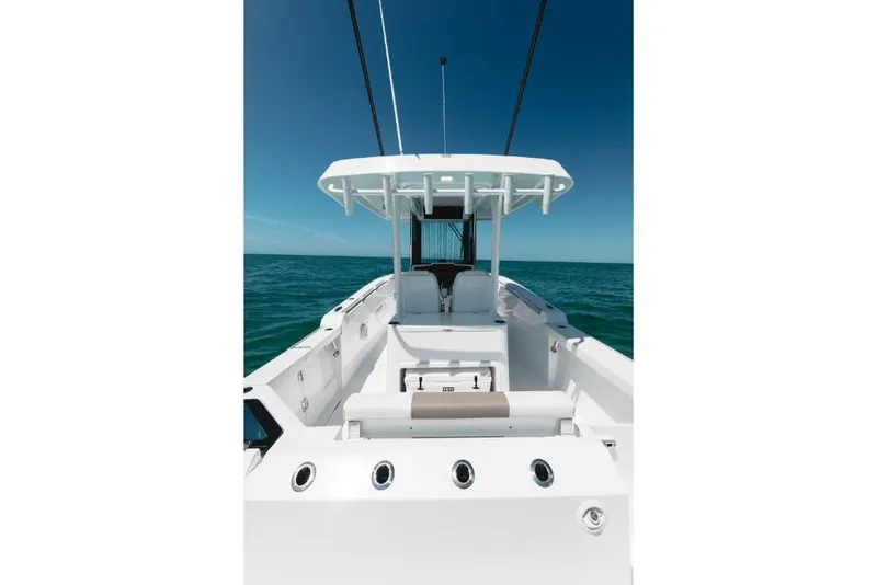 Slide: The Image of 2023 Bertram 28CC boat with center console on open water. - 43