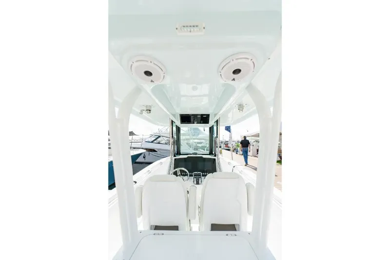 Slide: The Image of Interior view of 2023 Bertram 28CC boat with white seating and modern controls. - 47