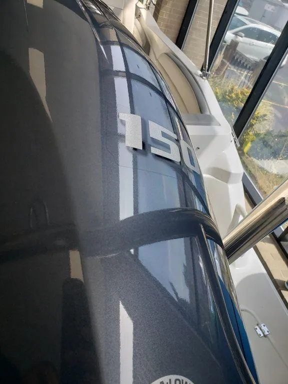 Slide: The Image of 2022 Hurricane SunDeck Sport 205 OB boat engine close-up. - 9