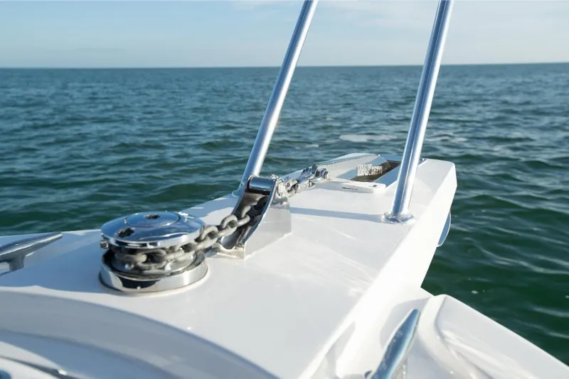 Slide: The Image of Close-up of the bow of a 2023 Bertram 35 Flybridge boat on the water. - 23