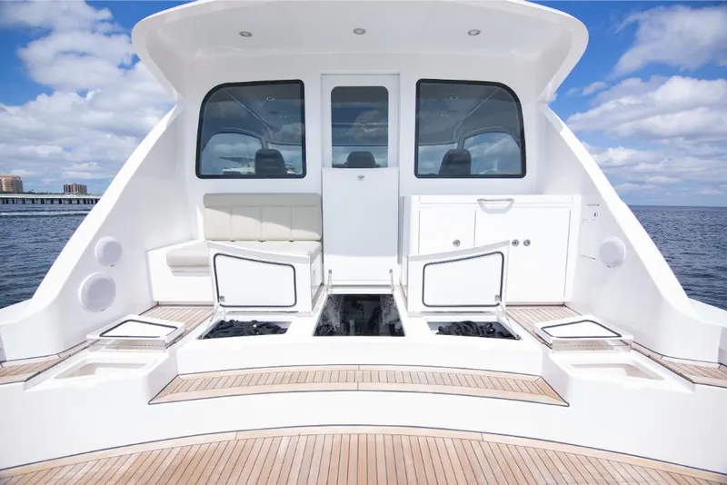 Slide: The Image of 2023 Bertram 50 Sport yacht deck with seating and storage compartments. - 31