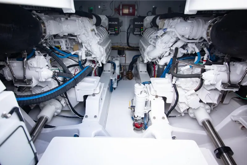 Slide: The Image of Engine room of a 2023 Bertram 50 Sport yacht with dual MAN engines. - 32