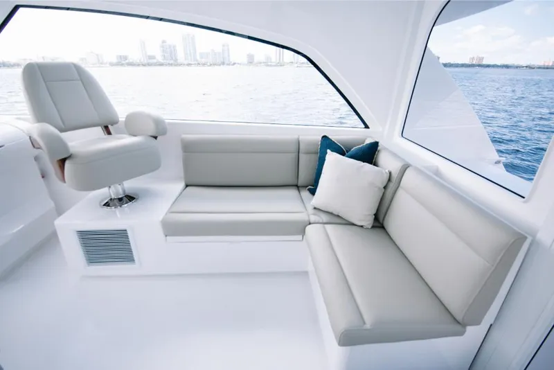 Slide: The Image of Interior of 2023 Bertram 50 Sport yacht with modern seating and ocean view. - 42