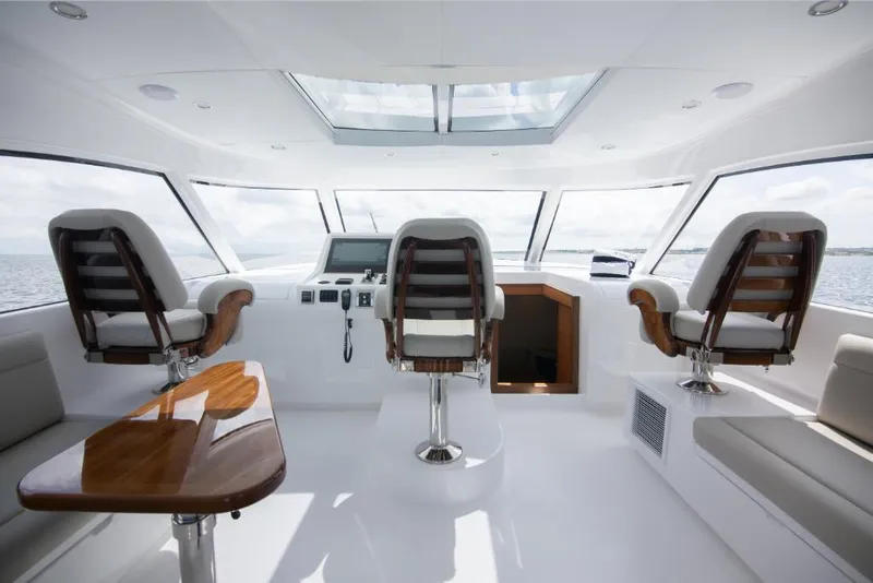 Slide: The Image of Interior of 2023 Bertram 50 Sport yacht with modern helm and seating. - 43