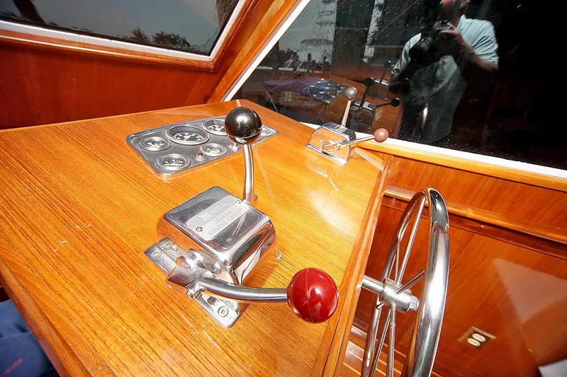 Slide: The Image of 1971 Hatteras 45 Convertible helm controls and steering wheel. - 14