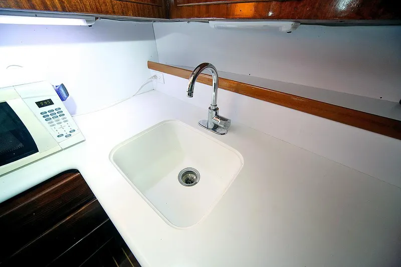 Slide: The Image of 1971 Hatteras 45 Convertible yacht kitchen sink and countertop. - 18
