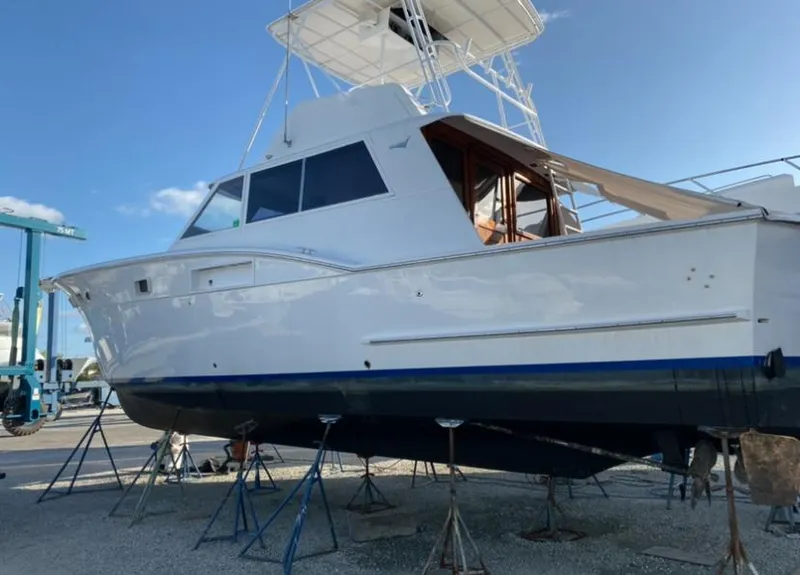Slide: The Image of 1971 Hatteras 45 Convertible yacht on stands for maintenance. - 2