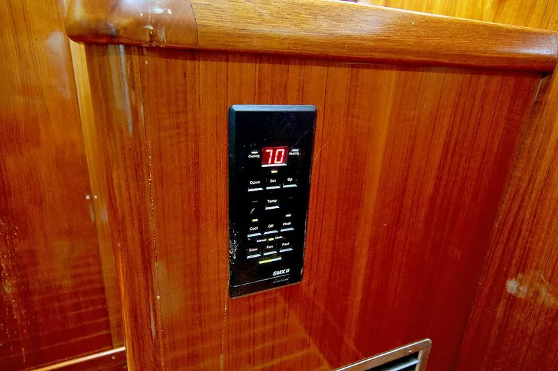 Slide: The Image of Digital control panel on 1971 Hatteras 45 Convertible yacht's wooden interior. - 40