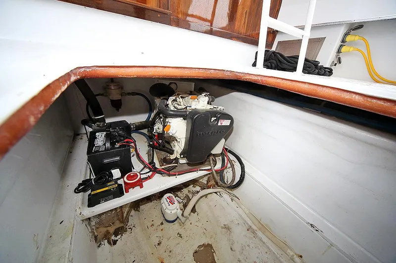 Slide: The Image of 1971 Hatteras 45 Convertible engine compartment with battery and wiring. - 45