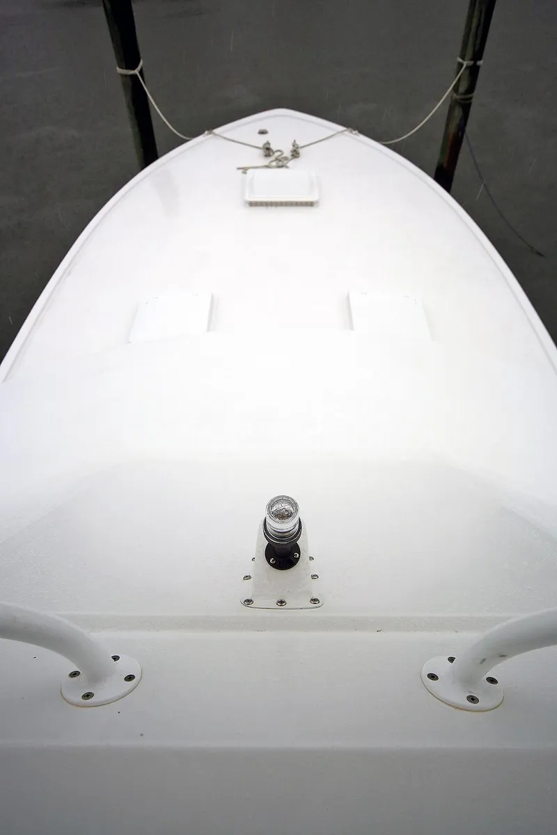 Slide: The Image of 1971 Hatteras 45 Convertible boat deck, clean and white, docked. - 46