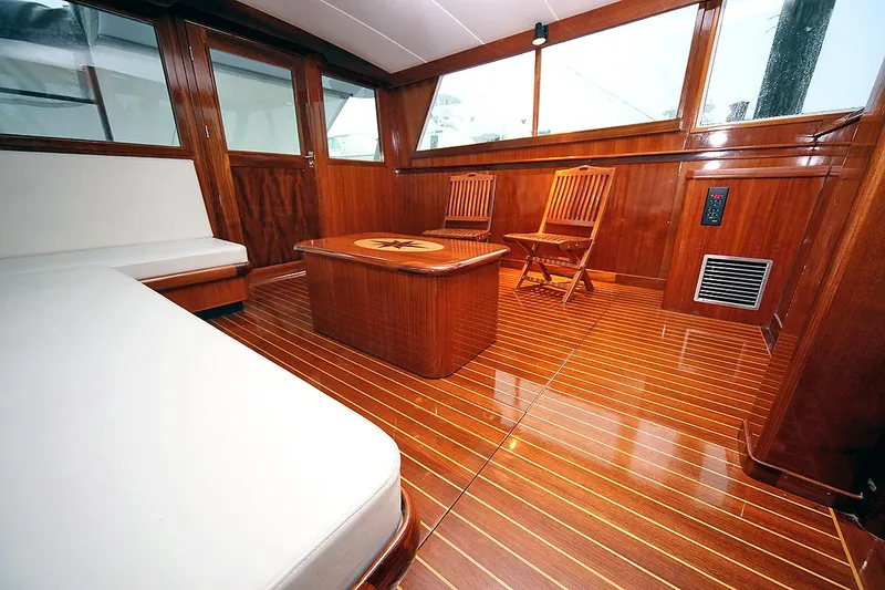 Slide: The Image of Interior of 1971 Hatteras 45 Convertible yacht with wooden furnishings and seating. - 5