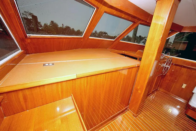 Slide: The Image of 1971 Hatteras 45 Convertible yacht interior with polished wood finish. - 8