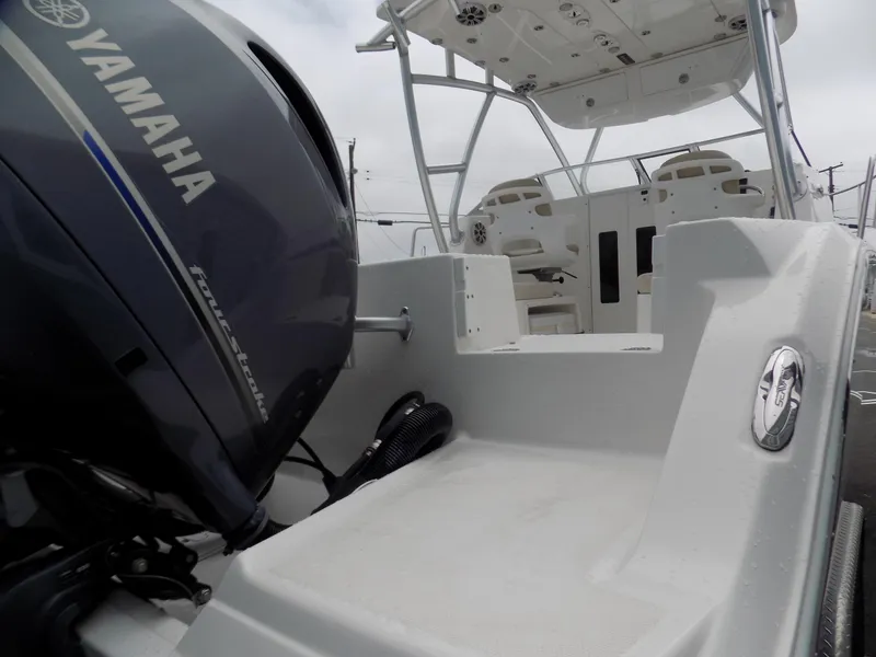 Slide: The Image of 2017 Sea Fox 256 Voyager boat with Yamaha outboard motor, showcasing deck and seating area. - 4