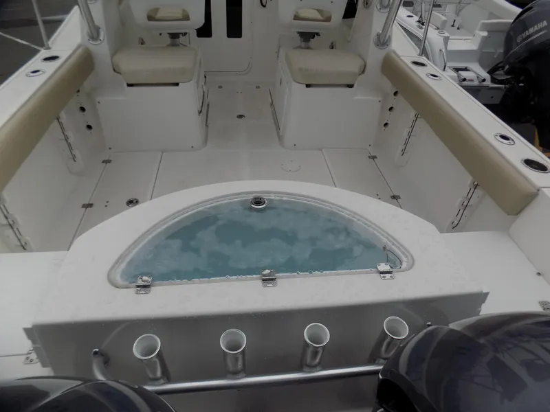 Slide: The Image of 2017 Sea Fox 256 Voyager boat interior with seating and livewell. - 5