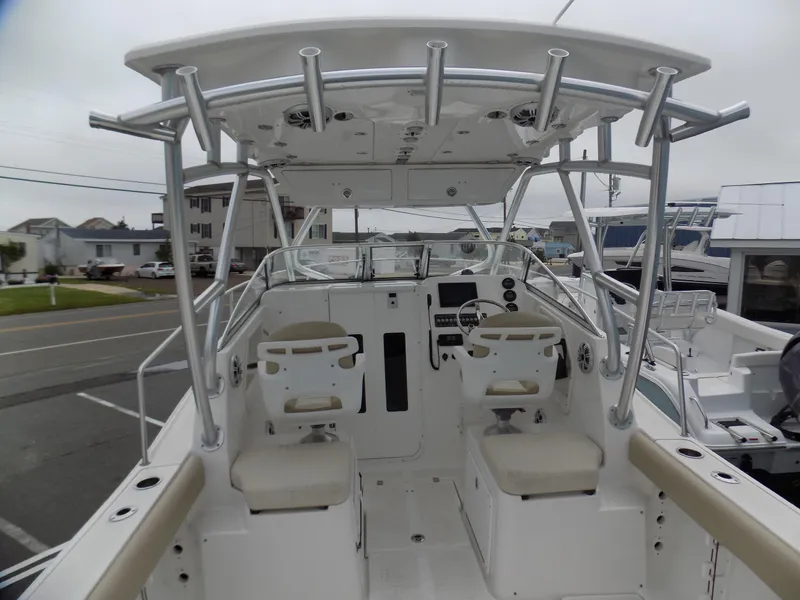 Slide: The Image of 2017 Sea Fox 256 Voyager boat interior with dual helm seats and T-top. - 7