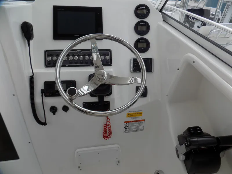 Slide: The Image of Steering console of 2017 Sea Fox 256 Voyager boat with gauges and controls. - 9