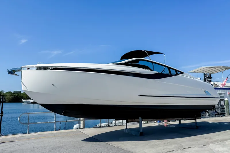 Slide: The Image of 2021 Fairline F Line 33 yacht on display by the water. - 0