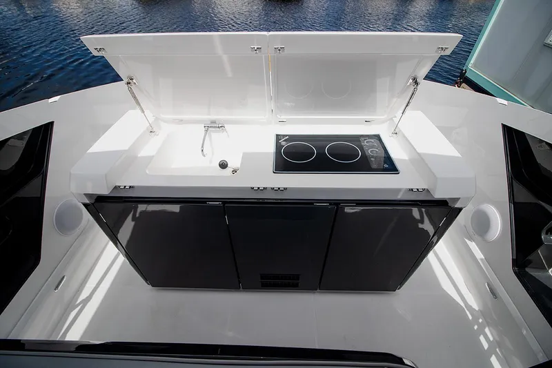 Slide: The Image of Outdoor kitchenette on 2021 Fairline F Line 33 yacht with sink and stove. - 16