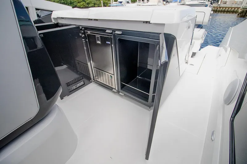 Slide: The Image of 2021 Fairline F Line 33 yacht with open storage compartments. - 17