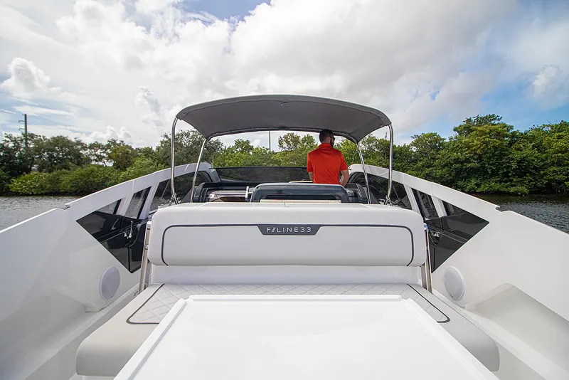 Slide: The Image of 2021 Fairline F Line 33 luxury yacht with canopy and rear seating. - 19