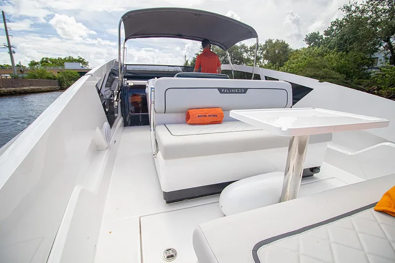 Slide: The Image of 2021 Fairline F Line 33 luxury yacht interior with seating and table. - 20