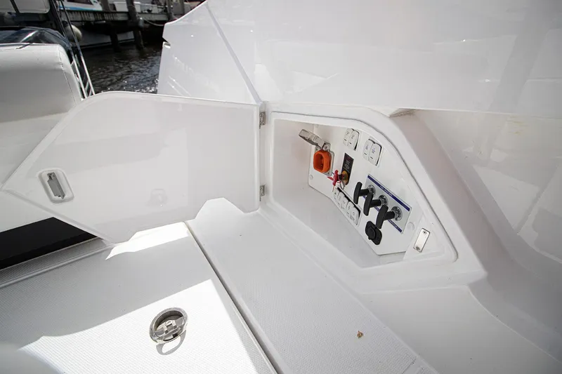 Slide: The Image of 2021 Fairline F Line 33 boat control panel compartment. - 23