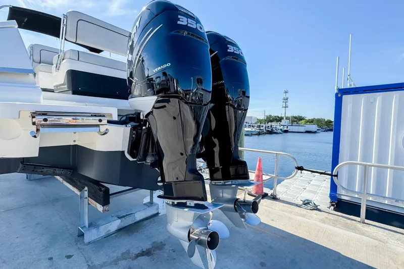 Slide: The Image of 2021 Fairline F Line 33 boat with dual Mercury Verado 350 engines docked by the water. - 3