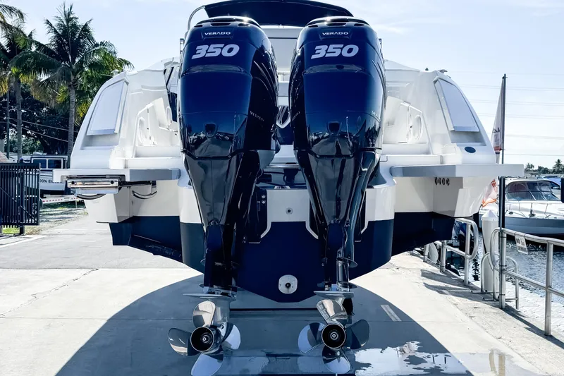 Slide: The Image of 2021 Fairline F Line 33 boat with dual 350 Verado engines docked. - 4
