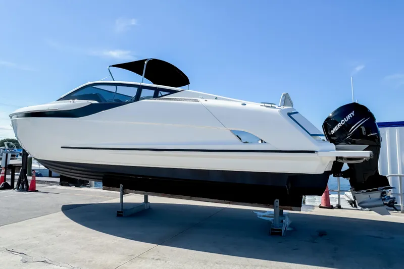 Slide: The Image of 2021 Fairline F Line 33 boat with Mercury engine on display outdoors. - 5