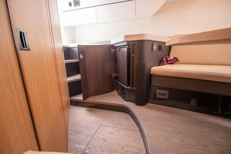 Slide: The Image of Interior cabin of 2021 Fairline F Line 33 yacht with wooden cabinetry and seating. - 50