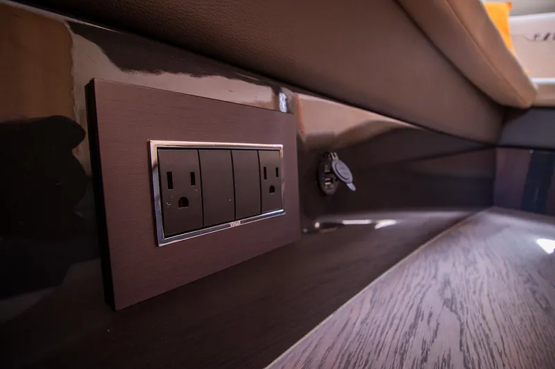 Slide: The Image of Power outlet and USB port on 2021 Fairline F Line 33 yacht interior. - 54
