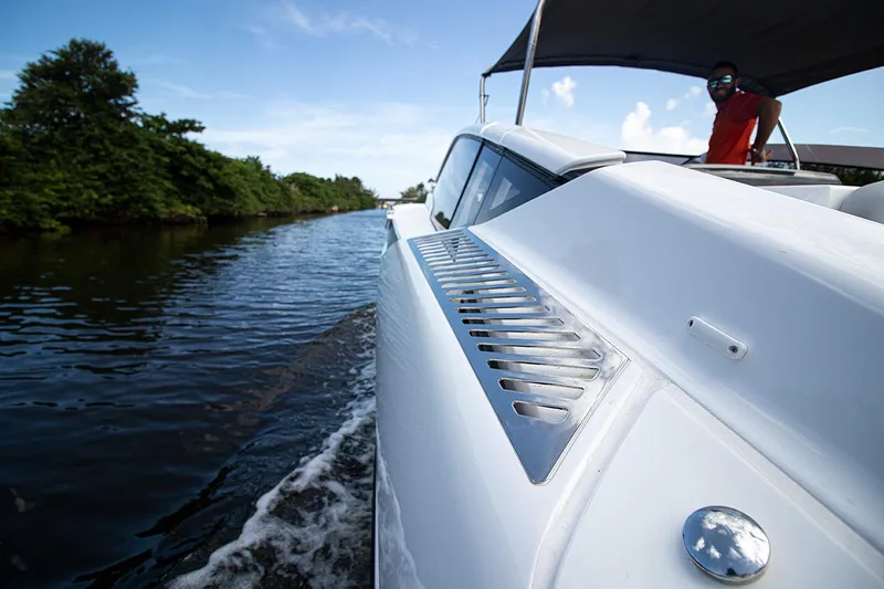 Slide: The Image of 2021 Fairline F Line 33 cruising on a river. - 56