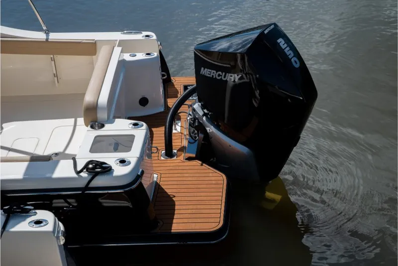 Slide: The Image of 2023 Scout 240 Dorado boat with Mercury outboard engine on water. - 11