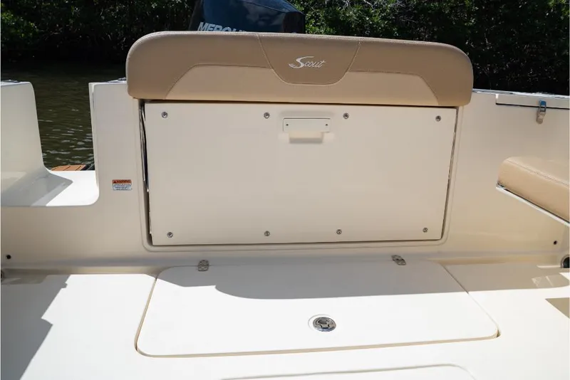 Slide: The Image of 2023 Scout 240 Dorado boat interior with storage compartment and seating. - 14