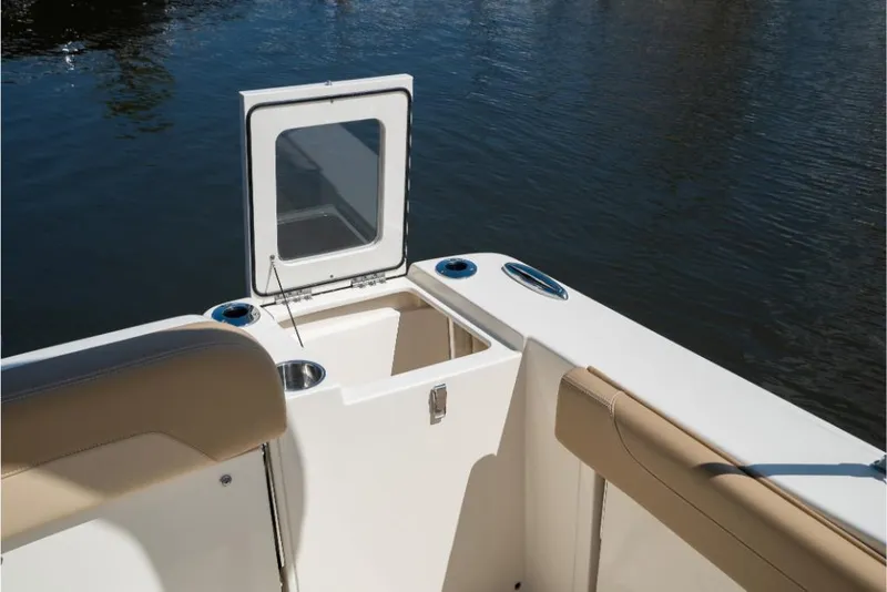Slide: The Image of 2023 Scout 240 Dorado boat with open storage compartment and seating. - 17