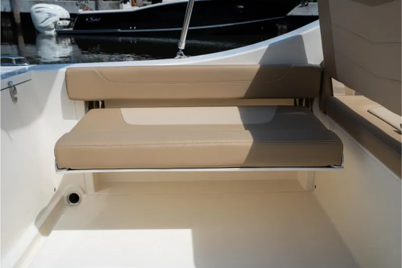 Slide: The Image of 2023 Scout 240 Dorado boat with tan seating at the stern. - 20