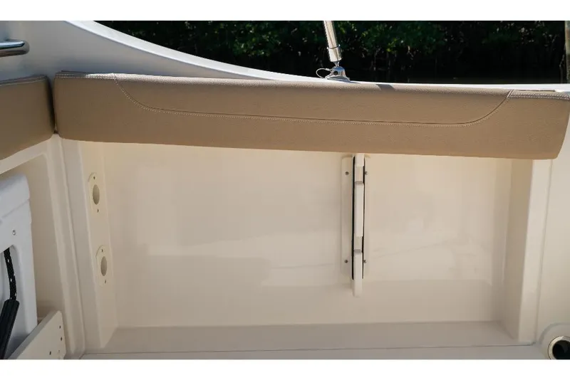Slide: The Image of 2023 Scout 240 Dorado boat interior with beige cushioned seating. - 28