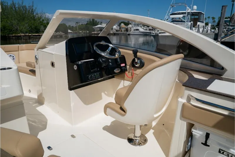 Slide: The Image of 2023 Scout 240 Dorado boat interior with helm station and captain's chair. - 30