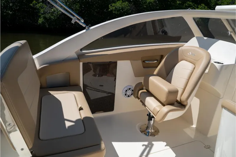 Slide: The Image of 2023 Scout 240 Dorado boat interior with beige seating and modern design. - 35
