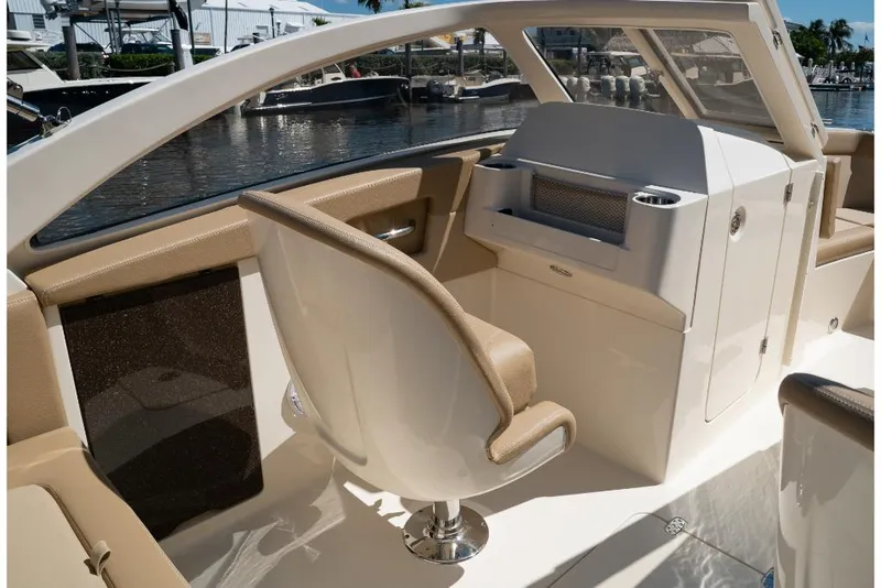 Slide: The Image of 2023 Scout 240 Dorado boat interior with helm station and seating. - 37