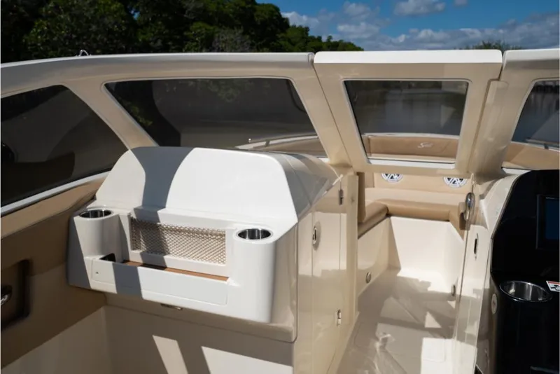 Slide: The Image of 2023 Scout 240 Dorado boat interior with seating and storage compartments. - 40