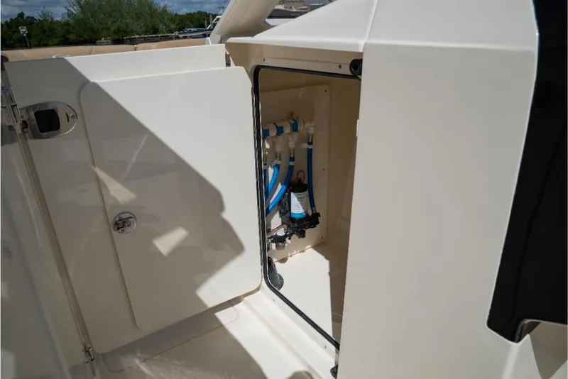 Slide: The Image of 2023 Scout 240 Dorado boat storage compartment with plumbing system. - 42
