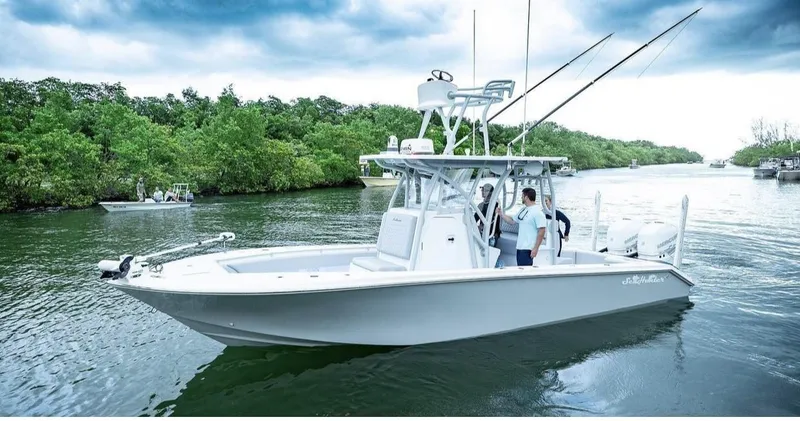 The Image of 2021 SeaHunter 28 Floridian boat on a calm river. - 0