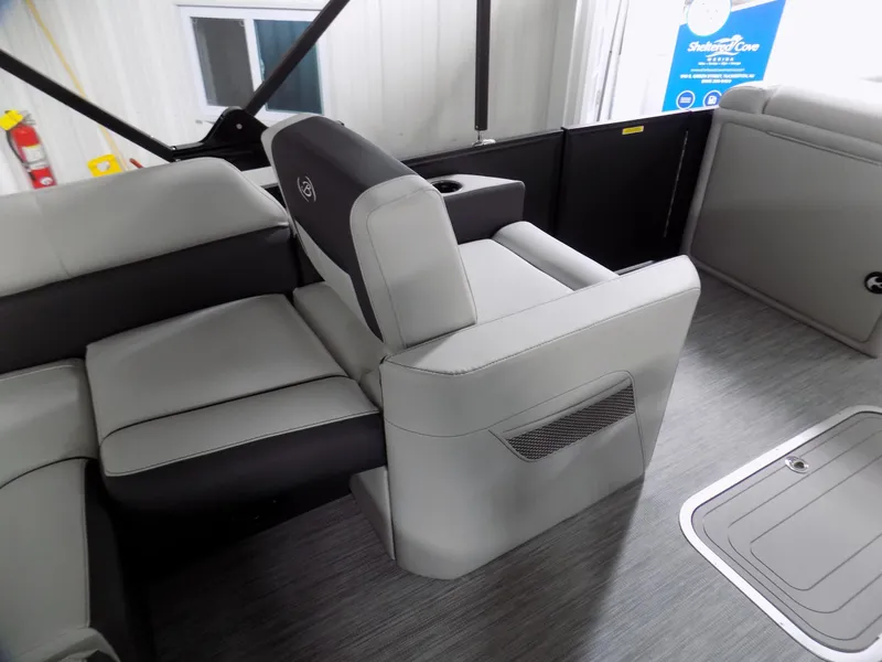 Slide: The Image of 2023 Barletta Corsa 23U boat interior with gray seating and modern design. - 11