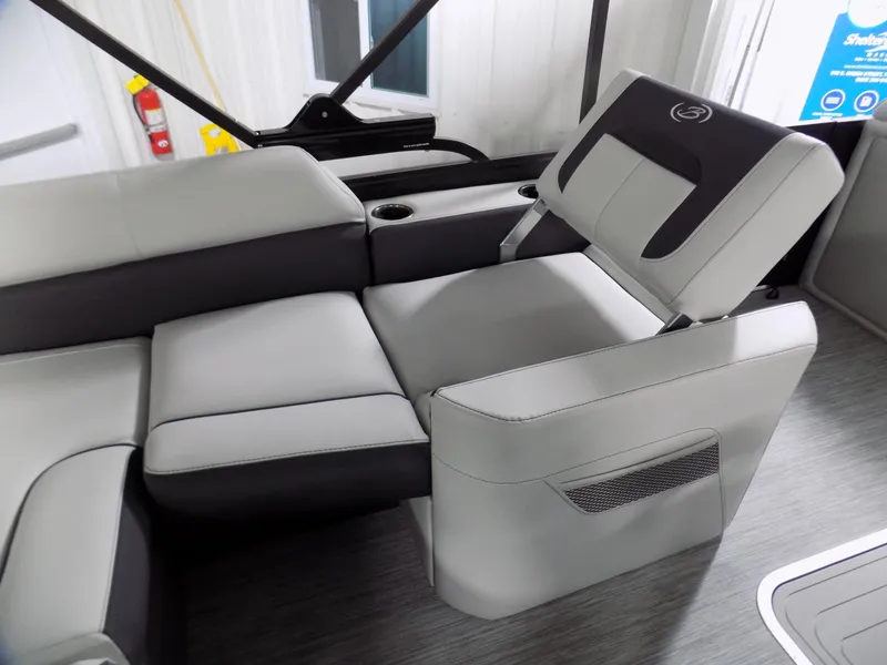 Slide: The Image of 2023 Barletta Corsa 23U boat interior with sleek gray seating and cup holders. - 12