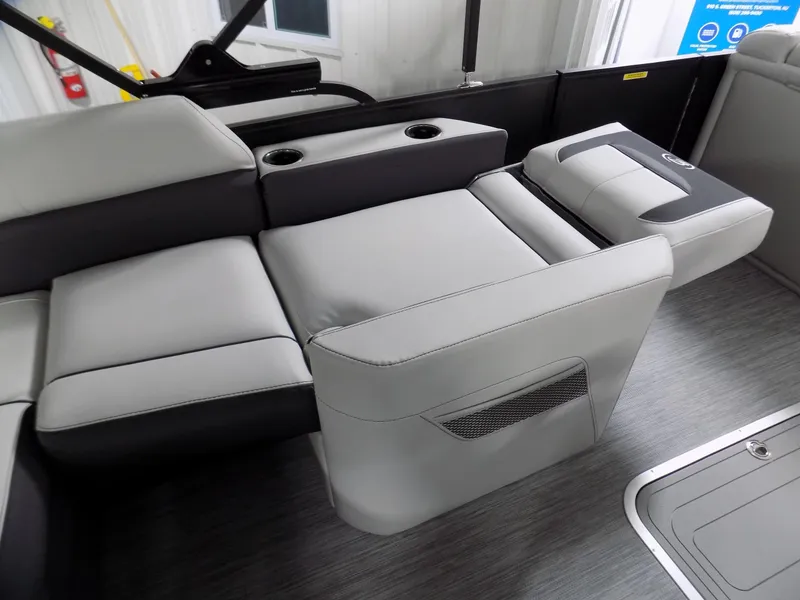 Slide: The Image of 2023 Barletta Corsa 23U boat interior with gray seating and cup holders. - 13